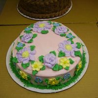 Pink Easter Egg Roses & Daisies are piped from buttercream, Daffodills & Forget-Me-Nots are sugar flowers.