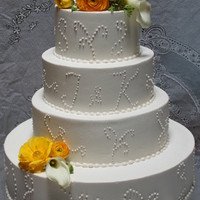 Kayla's Wedding Cake Buttercream, red velvet cake with cream cheese filling. Fresh flowers.