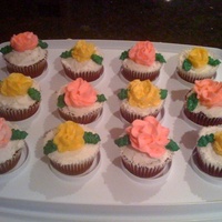 Flower Cupcakes Red Velvet cupcakes with butter cream frosting. Flowers are butter cream as well.