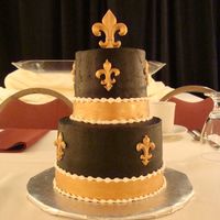 Saints Groom's Cake This was my first wedding and I had the grooms cake and the wedding cake! It's a 6in and 4in cake (very hard to work with!! Covered in...