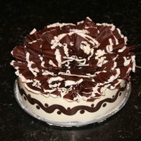 Chocolate Ruffled Chocolate Hazelnut Swirl Cheesecake Chocolate Hazelnut Swirl Cheesecake topped with Pastry Cream and Bittersweet & white chocolate ruffles using a Girouette. Made my own...