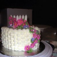 Basketweave Buttercream basketweave with Royal Icing flowers & color flow fence