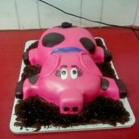 Pig Cake White cake covered in buttercream and fondant. All of the spots, eyes, collar, feet, etc...are also fondant. The "mud" is brown...