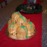Pile O'pumpkins This is a spice cake made into mini bunt cakes that are sanwiched together with cream cheese frosting and stacked on top of one another and...