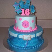 Denim Sweet 16 10 in Round and 6 in Round. Covered in Buttercream.The belt , stars and dots are fondant. The 16 is molded chocolate.I got the denim look...