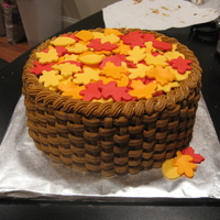 Basket Of Leaves Pumpkin spice cake with cream cheese frosting and fondant leaves.