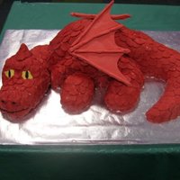 Dragon Cake This is a dragon cake that I made for my son's 4th birthday. The main part of the body is cake. The neck, head, feet and tail are rice...