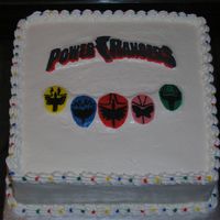 Power Rangers Did this cake last minute for my neighbor. Not very happy with the outcome. WASC with buttercream icing and FBCT.