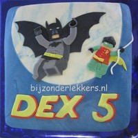 Lego Batman puzzle cake that means I cut all the seperat pieces out of marzefond and puzzeled them together as a plaque and put the whole thing on the...