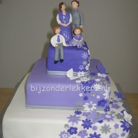 Purple Wedding the couple already had two children ans wanted them to be on the cake.statue hand molded out of marsefond.