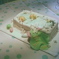 Baby Bath And Bubbles Bathtub is yellow cake frosted with buttercreme and covered in Fondant. Towel, stool, soap, duckies and bubbles are also Fondant.