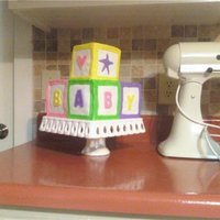 Baby Shower For Miriam Half chocolate/half yellow. Fondant decorations with buttercream underneath. The letters were cut with Jello Jiggler cutters.