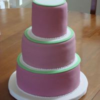 Fushia And Green Wedding Cake My very first paid cake! This was a small display wedding cake atop a cupcake stand. I had so many problems with this cake! Thank goodness...