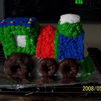 Train Birthday Cake I did this cake for a friend of mines son. The cake is all butter cream icing the wheels or donughts.