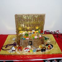 Pirate Treasure Box My neighbor wanted this cake for her 6th birthday. She didn't want a cake top so I used a gold wrapped cake board and tilted it to...