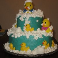 My Fir=St Tier Cake! This is devils food with BC. The larger bubbles are made with fondant and the two large duckies are store bought rubber duckies. I know...