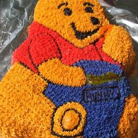 Pooh Bear Yellow cake with rainbow jimmies, BC icing. This was my first try at a character cake, I had so much fun and my kids loved it. The picture...