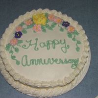 Anniversary Cake I made this for a good friend,she loved it! Yellow cake with BC frosting and RI flowers. I need to practice on my writing and I just...