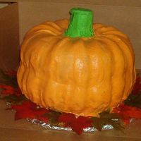3D Pumpkin Cake This was a lot of fun to make. Bottom of cake is chocolate and top is yellow with BC icing.