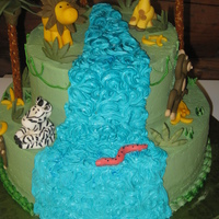 Jungle Babies Baby Shower Cake This is by far my favorite cake I have ever made, and it was for my own shower. :-) covered in buttercream frosting, with fondant animals...