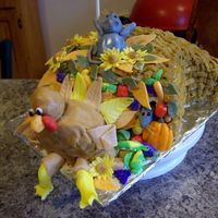 Cornucopia Cake With Turkey This is a Heavenly Pumpkin Spice cake, with Pumpkin Cream Cheese filling, iced with BC and the decorations are made with fondant/gum paste...