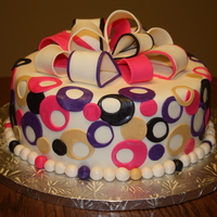 Circle Cake Chocolate/Yellow Marble cake with buttercream filling. All decorations are fondant.