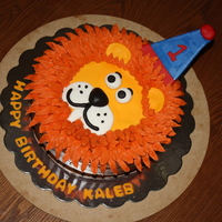 Lion Head Cake This was for a friends little boys 1st birthday. The face is made with fondant and mane is buttercream. Smaller cake is his smash cake.