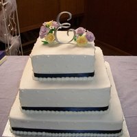 Grace's Day WASC with buttercream frosting and gumpaste flowers on top.