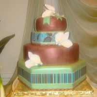 50Th Birthday Cake bottom layer is dummy covered with fondant, the three layers are cakes. Each one with different flavor. hand made cala lilies out of...