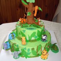 Jungle Birthday 14" and 9" round marble cakes with buttercream icing and fondant animals.
