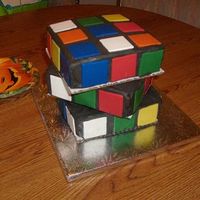 Rubik's Cube My version of the rubik's cube cake. I made my own 29th birthday cake. If I made it again I'd cover the boards with black fondant...
