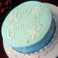 Snowy Christmas 8" chocolate cake w/ raspberry filling and vanilla buttercreamFondant accents made with Cricut