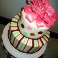 Pink Shimmer 6" and 9" white chocolate cake w/ raspberry cream fillingalmond butercreamFondant accents and bow