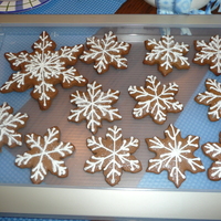 Gingerbread Snowflake Cookies With all the snow we are having I just had to make gingerbread snowflake cookies with royal icing and sugar glitter. Thanks for looking...