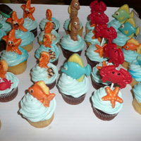 Under The Sea Cupcakes yellow cupcakes and chocolate cupcakes with buttercream frosting and chocolate under the sea creatures. thanks for looking