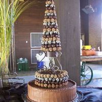 Chocolate And More Chocolate Two tier chocolate cake with chocolate mousse filling and chocolate frosting. Second tier has handmade chocolate truffles and top is choc....