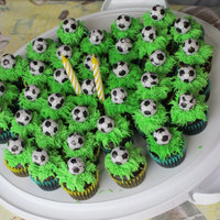Soccer Cupcakes Chocolate cupcakes iced with buttercream with chocolate soccerball caketopper.