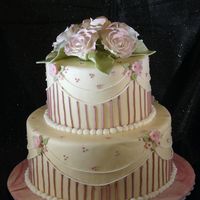 In The Pink This is taken off the cake design in the front cover of the 2009 Wilton year book.A cake Dummy covered in MMF and decorated with royal...