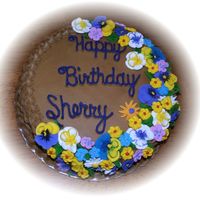 Round Basketweave This is a chocolate cake with chocolate buttercream icing. The side are basketweave. All of the flowers are made from royal icing. Thanks...