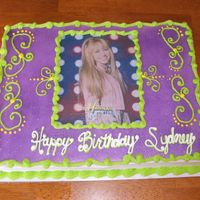 Hannah Montana This is a cake I made for a friends little girl. It has a edible picture of Hannah Montana on it, lime green, yellow and white dream...