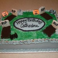 Graveyard dirt is oreo crumbs, headstones are pepperidge farm "Chessmen" cookies dipped in gray white chocolate