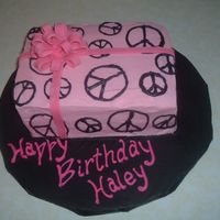 Peace Birthday Pink wrapping paper with black peace signs. Fondant bow.