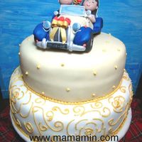 Driving Into The Sunset... Wedding cake with bride and groom in a replica of their bridal car.