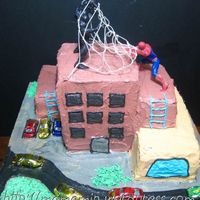 Spiderman And Venom I've had fun making this cake! Spidey and Venom are toys. Cars are choc in foil. Decorated with buttercream.