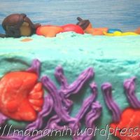 Snorkelling In The Tropical Sea Part of the cake which depicts a couple of swimmers snorkelling in the tropical sea. I don't know how to make a montage of photos!...