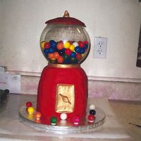 Gumball_Machiene.jpg The gumballs are real! The globe was a fish bowl. Stacked rounds covered with fondant.