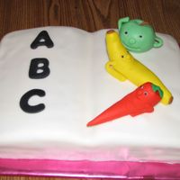 A B C Book This cake is covered in Fondant with fondant fruits and carrot.Fondant letters.I gave this to the school for the cake walk at the fall...