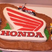 Honda/ Racetrack This was for my nephew's 8th birthday. He just got a Honda dirt bike for Christmas so his parents wanted his cake to have something to...