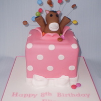 Horse Present Birthday Cake love love love this one. this is another one that i really enjoyed doing. the horse is made from fondant and the "explosion"...
