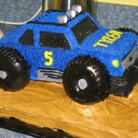 Tyler's Car Cake Cake was made for my nephew's birthday...all bc with donuts for tires.